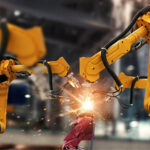 Orange robotic arms showing spark movements.